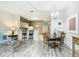 Bright dining area with a table and chairs, adjacent to the kitchen at 7663 Sir Kaufmann Ct, Kissimmee, FL 34747