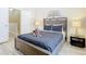 Cozy bedroom with a full-size bed and adjacent bathroom at 7663 Sir Kaufmann Ct, Kissimmee, FL 34747