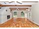 Bright living room with hardwood floors, fireplace, and large windows at 8901 Nw 136Th Avenue Rd, Ocala, FL 34482