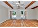 Bright living room with terracotta tile floors and access to the pool area at 8901 Nw 136Th Avenue Rd, Ocala, FL 34482