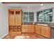 Kitchen featuring a large pantry with wicker baskets and terracotta tile floors at 8901 Nw 136Th Avenue Rd, Ocala, FL 34482