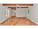 Spacious living area with terracotta tile floors and exposed wooden beams at 8901 Nw 136Th Avenue Rd, Ocala, FL 34482