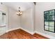Simple dining room with hardwood floors and chandelier at 8901 Nw 136Th Avenue Rd, Ocala, FL 34482