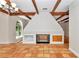Large, decorative fireplace in the dining area with ornate detailing and built-in shelving at 8901 Nw 136Th Avenue Rd, Ocala, FL 34482