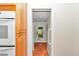 Kitchen hallway with terracotta tile floor and access to backyard at 8901 Nw 136Th Avenue Rd, Ocala, FL 34482