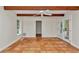 Bedroom with terracotta tile floors, french doors and ceiling fan at 8901 Nw 136Th Avenue Rd, Ocala, FL 34482