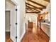 Kitchen with hardwood floors, exposed beams, and modern appliances at 8901 Nw 136Th Avenue Rd, Ocala, FL 34482