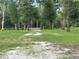 Long driveway leading to a gated entrance at 10566 Cr 671, Bushnell, FL 33513