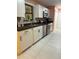 Modern kitchen with white cabinets and dark countertops at 10566 Cr 671, Bushnell, FL 33513