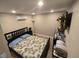 Guest bedroom with a double bed and mounted TV at 10566 Cr 671, Bushnell, FL 33513
