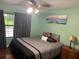 Bright bedroom with a ceiling fan and serene wall art at 10566 Cr 671, Bushnell, FL 33513