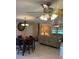 Spacious living room with dining area and ceiling fans at 10566 Cr 671, Bushnell, FL 33513