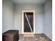 Front entry with dark brown door and tiled flooring at 7472 Oakmoss Loop, Davenport, FL 33837