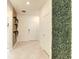 Entryway with white door and green wall at 7472 Oakmoss Loop, Davenport, FL 33837