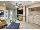 Bonus room with TV, sectional sofa, and laundry closet at 7472 Oakmoss Loop, Davenport, FL 33837