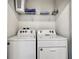 Convenient laundry room with washer and dryer at 7472 Oakmoss Loop, Davenport, FL 33837