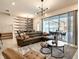 Spacious living room with sliding doors opening to a patio and pool at 7472 Oakmoss Loop, Davenport, FL 33837