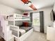 Cozy bedroom with a built-in bunk bed and Mickey Mouse decor at 7472 Oakmoss Loop, Davenport, FL 33837