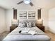 Main bedroom featuring a plush bed and calming decor at 7472 Oakmoss Loop, Davenport, FL 33837