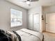 Spacious bedroom with a queen bed and large closet at 7472 Oakmoss Loop, Davenport, FL 33837
