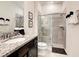 Clean bathroom with granite countertop, shower, and toilet at 7472 Oakmoss Loop, Davenport, FL 33837