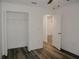 Bright bedroom featuring wood-look floors and a spacious closet at 604 W 12Th St, Lakeland, FL 33805