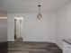 Kitchen dining area with pendant lighting and wood-look floors at 604 W 12Th St, Lakeland, FL 33805