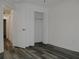 Spacious bedroom with wood-look floors and a large closet at 604 W 12Th St, Lakeland, FL 33805