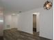 Bright hallway with white walls and wood-look floors at 604 W 12Th St, Lakeland, FL 33805