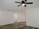 Spacious living room featuring wood-look vinyl flooring and a ceiling fan at 604 W 12Th St, Lakeland, FL 33805