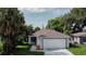 Newly built home with a two-car garage and landscaped yard at 604 W 12Th St, Lakeland, FL 33805