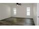 Well-lit bedroom with vinyl flooring and two large windows at 604 W 12Th St, Lakeland, FL 33805