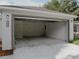 Attached garage with an automatic garage door at 604 W 12Th St, Lakeland, FL 33805