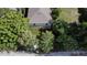 Aerial view of a house with a yard and palm trees at 604 W 12Th St, Lakeland, FL 33805