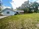 House with a large backyard, covered patio, and shed at 13659 Sw 115Th Pl, Dunnellon, FL 34432