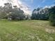 Aerial view showing a house with large backyard and surrounding trees at 13659 Sw 115Th Pl, Dunnellon, FL 34432