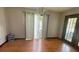 Simple dining room with hardwood floors and sliding glass doors at 13659 Sw 115Th Pl, Dunnellon, FL 34432
