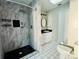 Updated bathroom with a walk-in shower and modern vanity at 13659 Sw 115Th Pl, Dunnellon, FL 34432