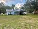 House with a large backyard, covered patio, and shed at 13659 Sw 115Th Pl, Dunnellon, FL 34432