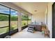 Screened-in patio with a relaxing hot tub and plenty of outdoor space at 4046 Dinner Lake Way, Lake Wales, FL 33859