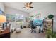 Bright and airy home office with a desk and comfortable seating at 4046 Dinner Lake Way, Lake Wales, FL 33859