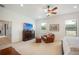 Spacious bedroom with large TV, comfortable seating, and ample natural light at 4046 Dinner Lake Way, Lake Wales, FL 33859