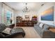 Relaxing sitting area with a comfortable chaise lounge and built-in shelving at 4046 Dinner Lake Way, Lake Wales, FL 33859