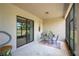 Covered patio with seating area, perfect for outdoor dining at 4046 Dinner Lake Way, Lake Wales, FL 33859