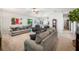 Bright and airy living room with multiple seating areas at 4046 Dinner Lake Way, Lake Wales, FL 33859