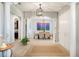 Elegant dining room with chandelier and large artwork at 4046 Dinner Lake Way, Lake Wales, FL 33859