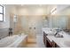 Elegant bathroom with a soaking tub, walk-in shower, and double vanity at 4046 Dinner Lake Way, Lake Wales, FL 33859