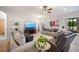 Relaxing living room featuring neutral decor and patio access at 4046 Dinner Lake Way, Lake Wales, FL 33859