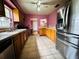 Kitchen with stainless steel appliances and wooden cabinets at 6004 Hilltop E Ln, Lakeland, FL 33809
