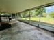 Spacious screened porch overlooks backyard, perfect for relaxing at 6004 Hilltop E Ln, Lakeland, FL 33809
